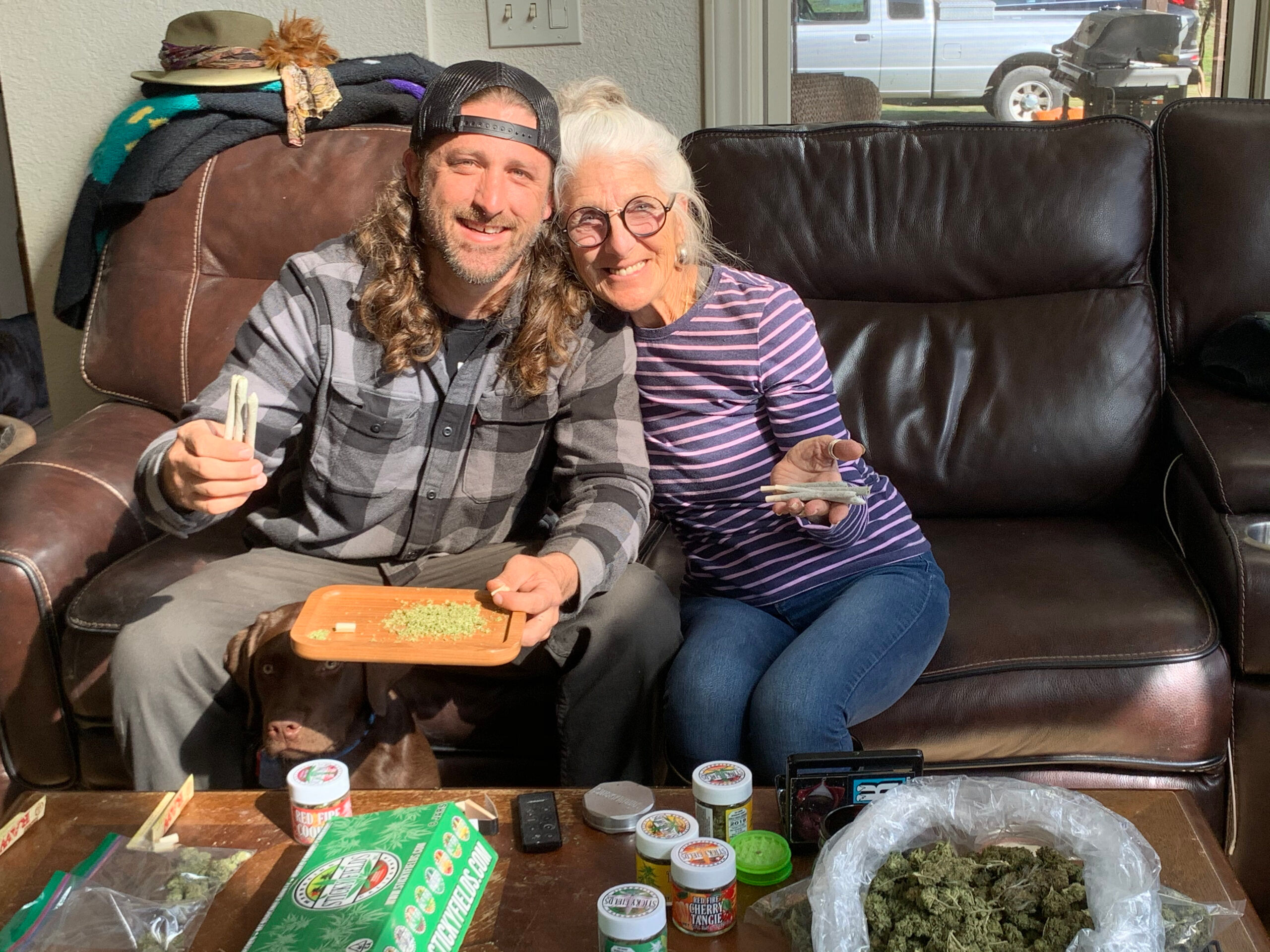 Jesse Robertson of Sticky Fields shares a joint with his mother.