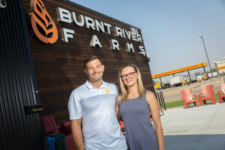 Burnt River Farms owners Shawn McKay and his wife Robin are pictured outside of the dispensary located in Ontario, Oregon.  