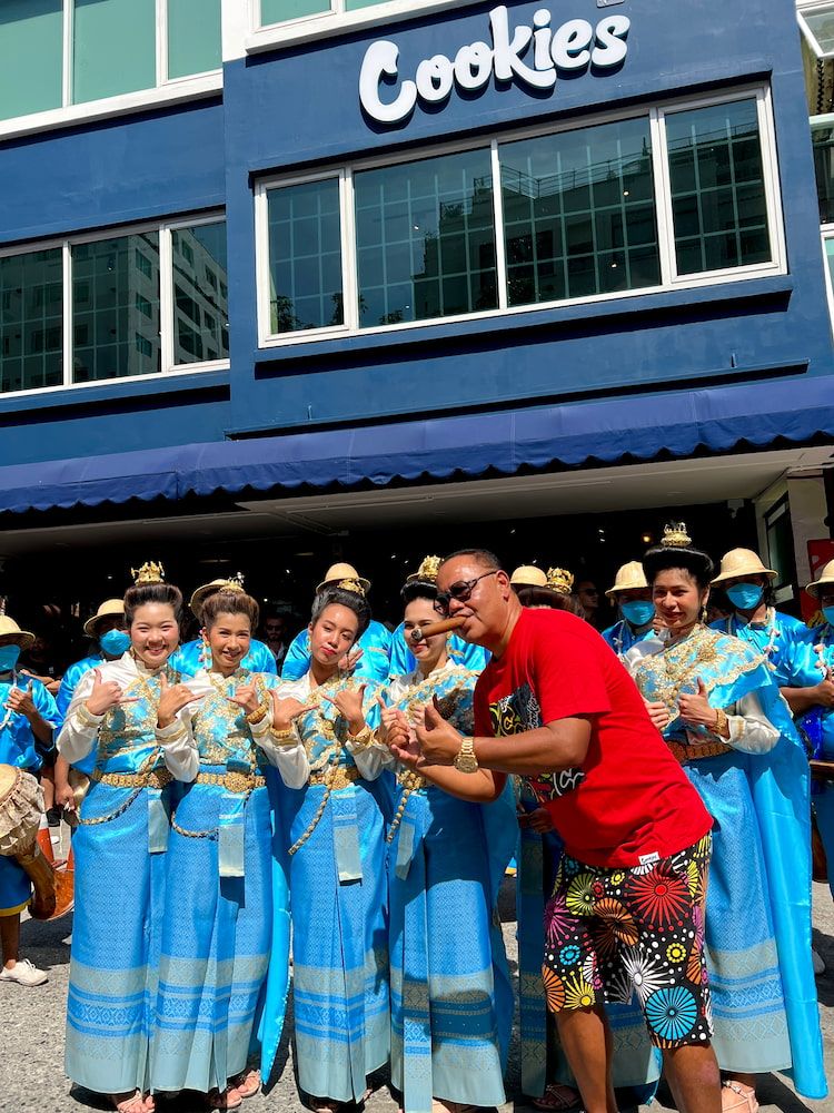 Cookies Bangkok partner Tom Kruesopon with Thai dancers at the store opening ceremonies on January 21, 2023.