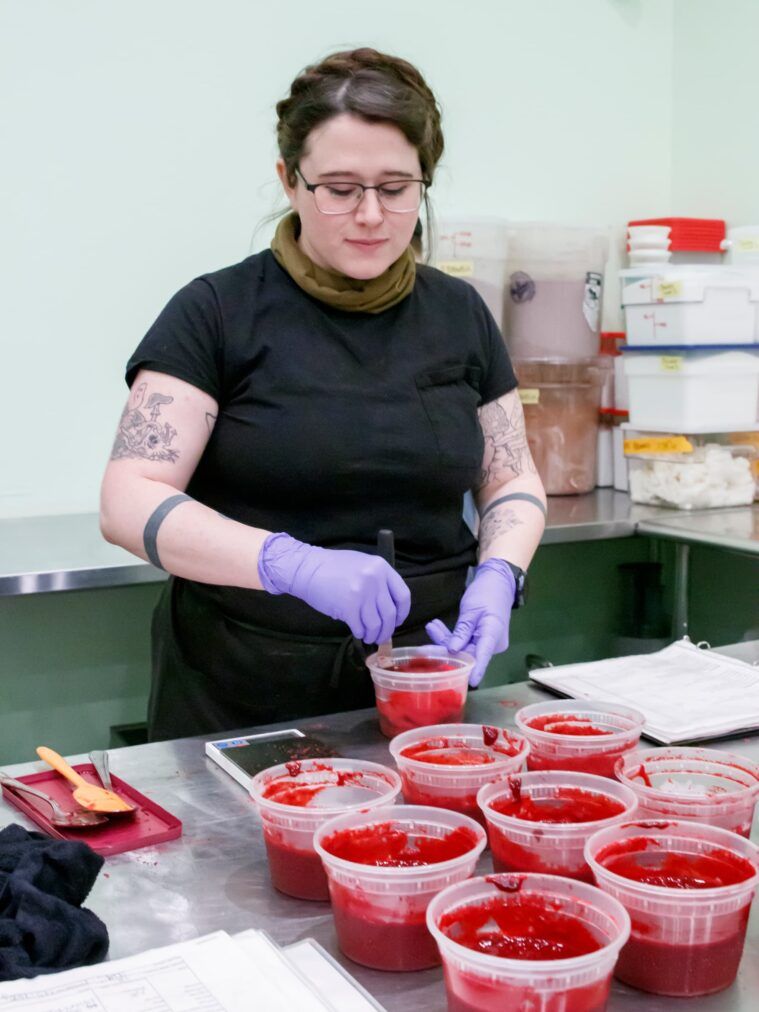 Hapy Kitchen employee baking in the company's facility.